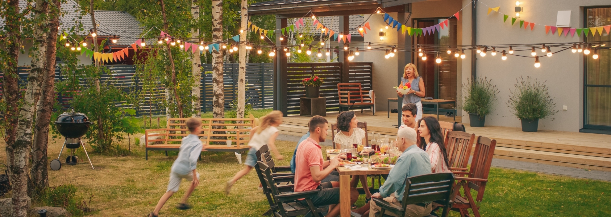 family eating oustide at picnic table